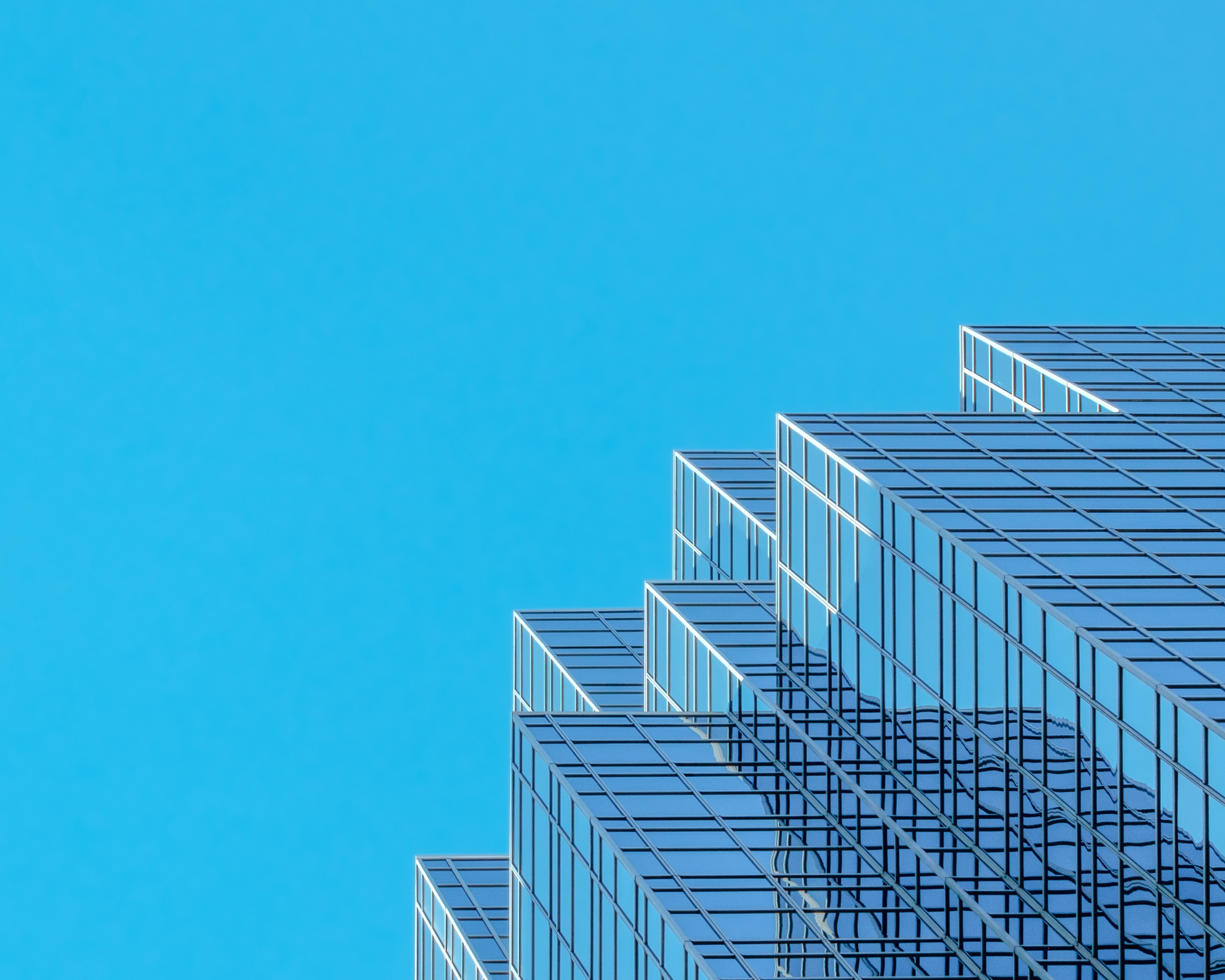 white and blue concrete building under blue sky during daytime